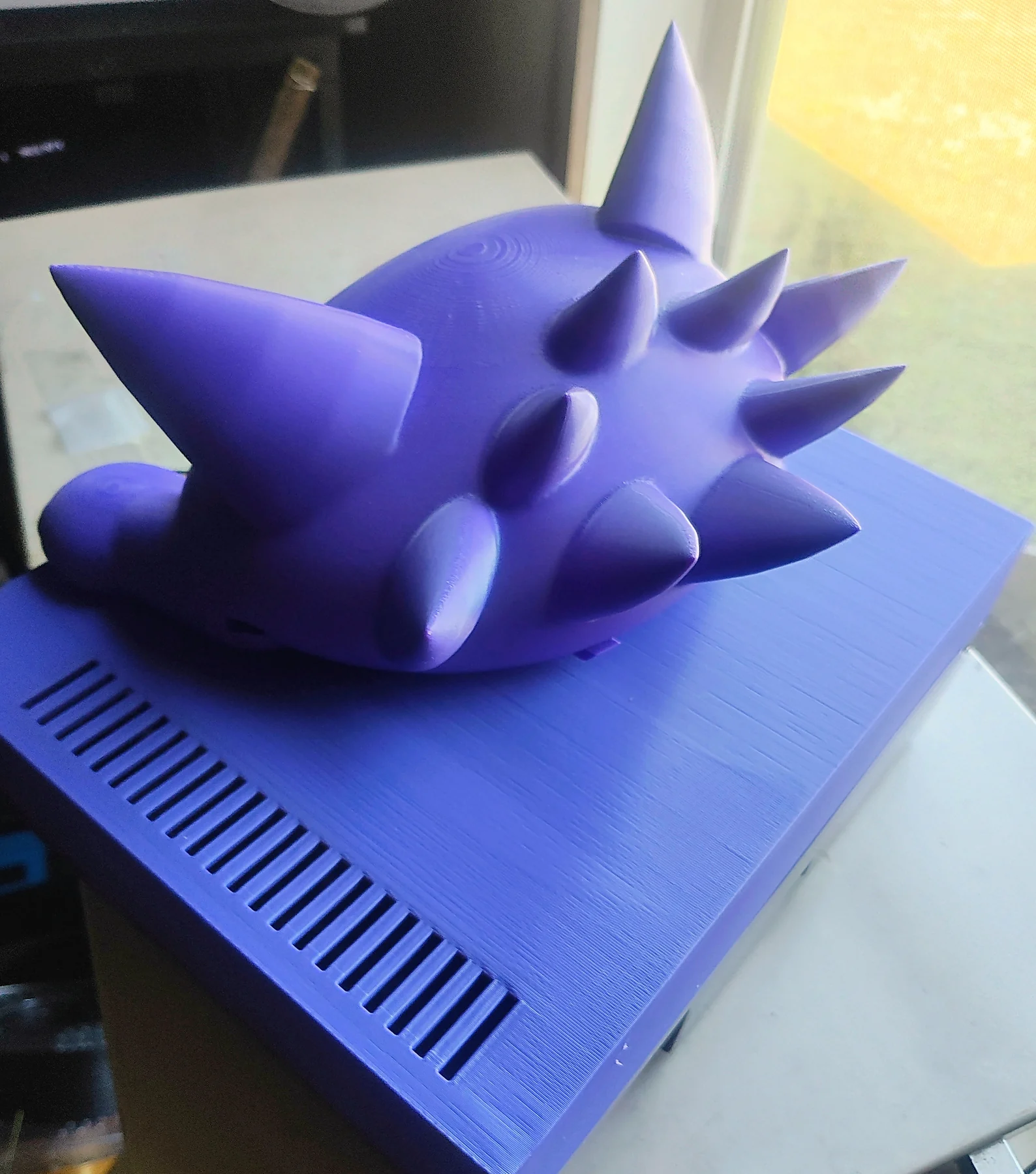 October 6, 2026 · The printed lid’s rear spikes and the purple shell’s vented surface. Work in progress. The finished lid is not for sale; the $20 print-file bundle includes the all-in-one topper and structural NES lid/deck. Lid and console are not included in the connector kit.