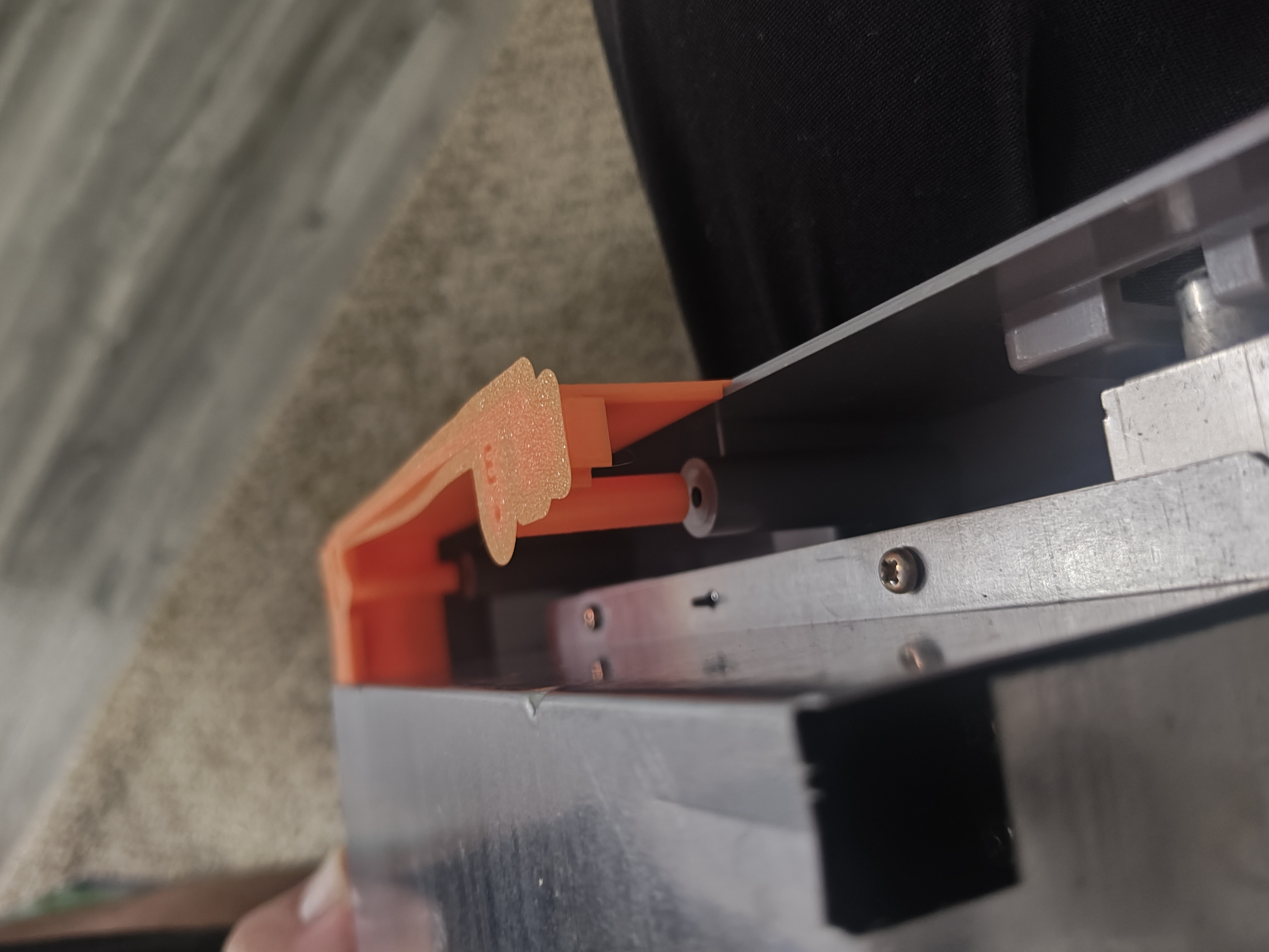 September 6, 2026 · Printed fitting beside the metal shield and console mounting post. Adjustments are still underway.